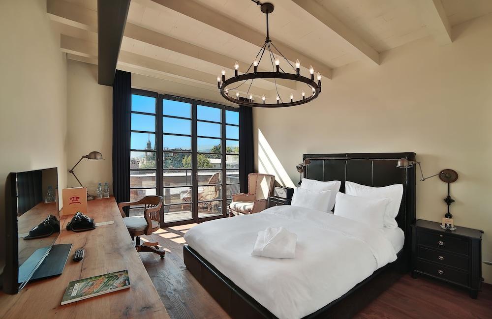 فندق رومز تبليسي المظهر الخارجي الصورة A bedroom